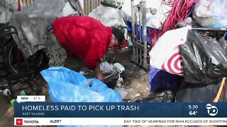 Homeless paid to pick up trash