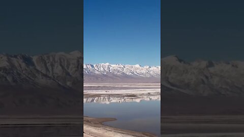 Camping in the winter has perks such as snowy mountains in every reflection.