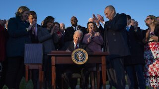 President Biden Signs $1T Infrastructure Deal With Bipartisan Crowd