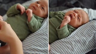 A Mother Massaging Her Baby's Feet