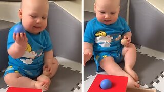 Baby unknowingly pulls off epic trick shot