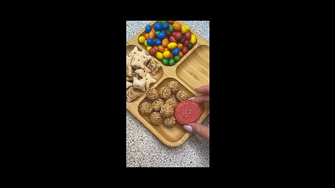 Filling platter with different type of sweets and chips _ASMR satisfying