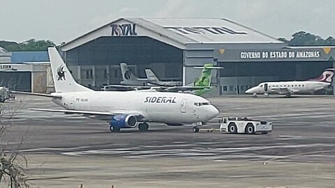 Boeing 737-300F PR-SLI beiing towed for cargo terminal of Manaus International Airport