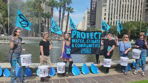 Watch: Extinction Rebellion Demonstrate at Adderley Street Water Fountain in Cape Town