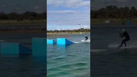 Attempting a wakeboard back roll on the big kicker!