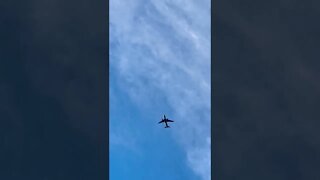 An airplane flying through the sky