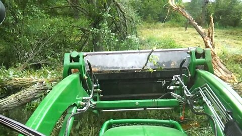 What YEAR? John Deere 4720 clearing land for food plot on 5 acre parcel. What is your guess??
