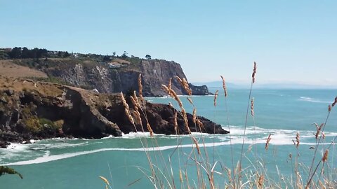 calming waves crashing on cliff rocks