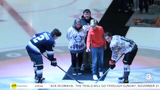 Family of fallen hero drop ceremonial puck at Omaha hockey game