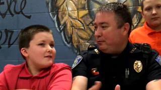 Officer adopts boy he rescued