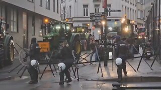 EU farmers breaking through police barricades as they fight towards the EU parliament in Brussels.
