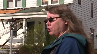 Jeep goes airborne and crashes into Akron home, hits gutter on second story