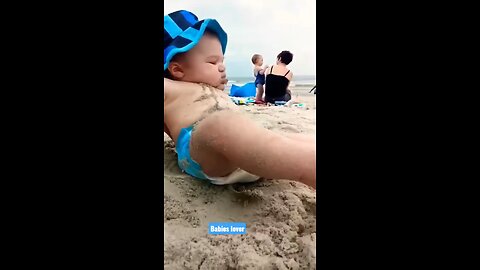 Funny baby reaction on the beach ||