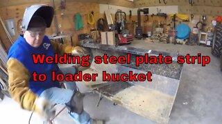 Welding steel plate to loader bucket