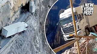 Hang on! Truck teeters off cliff in terrifying video