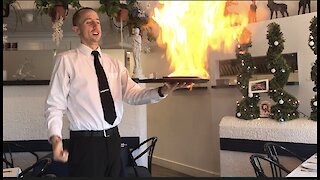 Three foot flaming inferno is part of the service at this Greek restaurant