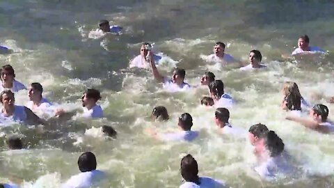 Teen grabs cross thrown into Spring Bayou on Epiphany