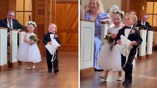Ring Bearer And Flower Girl Adorably Walk Down The Aisle