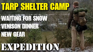 Heated tarp shelter overnight camp in freezing weather