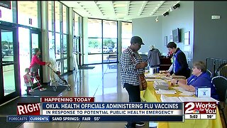 Health officials administering flu vaccine