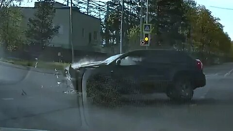 Impatient driver overtakes at an intersection to oncoming traffic.