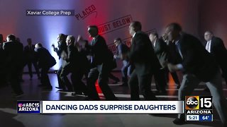 Dancing dads surprise daughters at Xavier College Prep dance