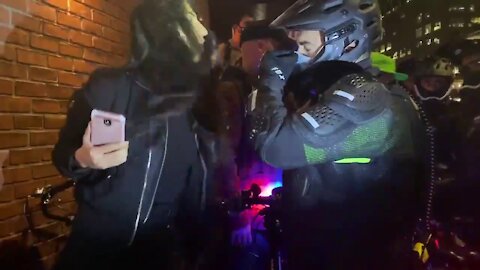 Stupid Antifa Girl spits in cops face, Gets slammed.