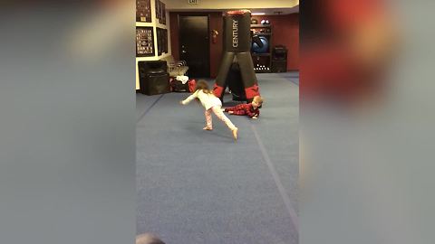 Toddler Boy Fails In Doing A Cartwheel And Falls Flat On His Stomach