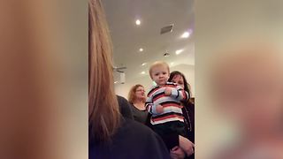 "Cute Toddler Boy Plays Imaginary Guitar in Church"