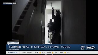 Former health official's home raided