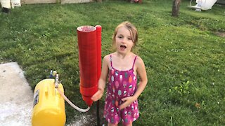 Kids help build confetti cannon