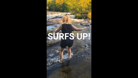 Shes surfing in the rapids #shorts