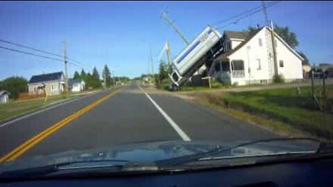 Truck cartwheels onto roof of house during bizarre accident