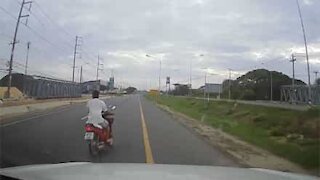 Carelessness of driver and motorcyclist nearly ends in a serious accident
