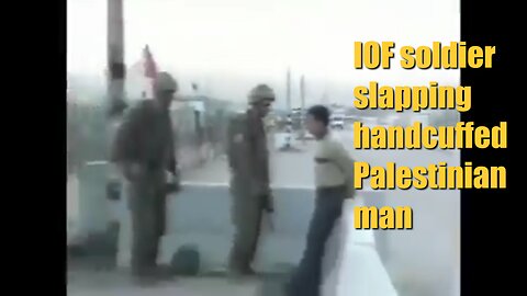 IOF soldier slapping handcuffed Palestinian man
