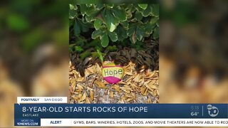 Young girl displays rocks with special messages in Eastlake neighborhood