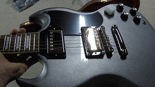 Gibson SG Standard '61 Electric Guitar - Silver Mist on the bench under the hood