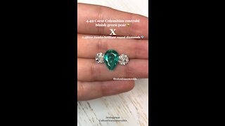 Loose 4.49 carat Pear cut electric blue green Colombian emerald accented by large round diamonds