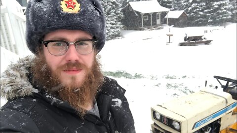 Plowing snow with a old garden tractor