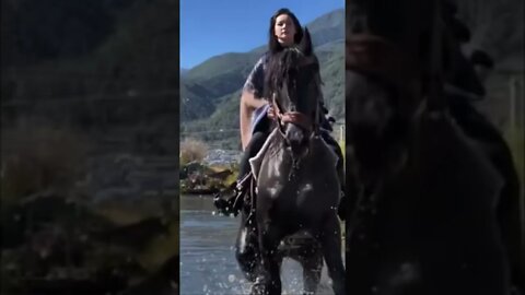 Pretty Chinese Countryside Girl Rides Her Beautiful Horse Across A Roaring River