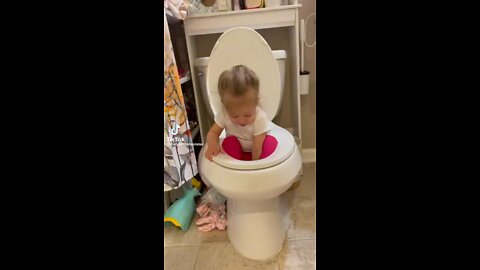 Little Girl Playing In The Toilet￼