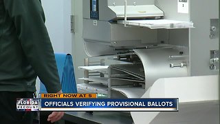 Officials verifying provisional ballots