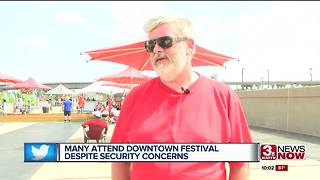 Many come out to downtown festivals despite safety concerns, heat