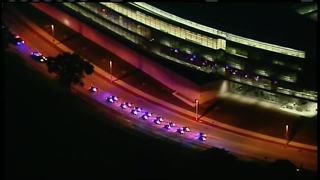 Police procession lights up Milwaukee highway