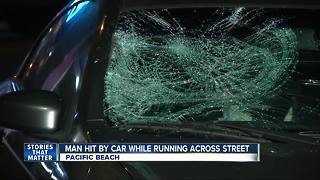 Man running across street in PB hit by car