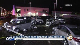 DUI suspect goes airborne into car lot