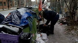 Volunteers scramble to help insure tent residents survive bitter cold