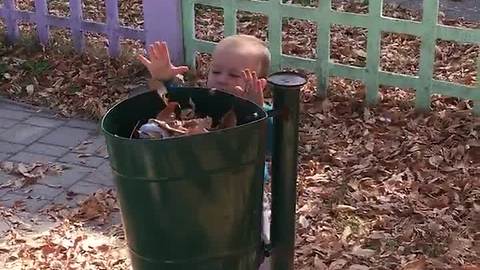 Toddler does his part by collecting trash
