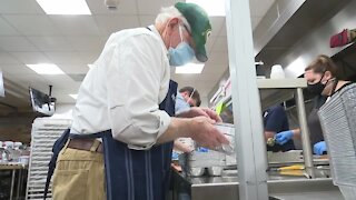 Volunteers pack Thanksgiving meals at Lambeau Field