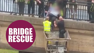 Hero scaffolders use harness and a cherry picker to save a woman on a bridge
